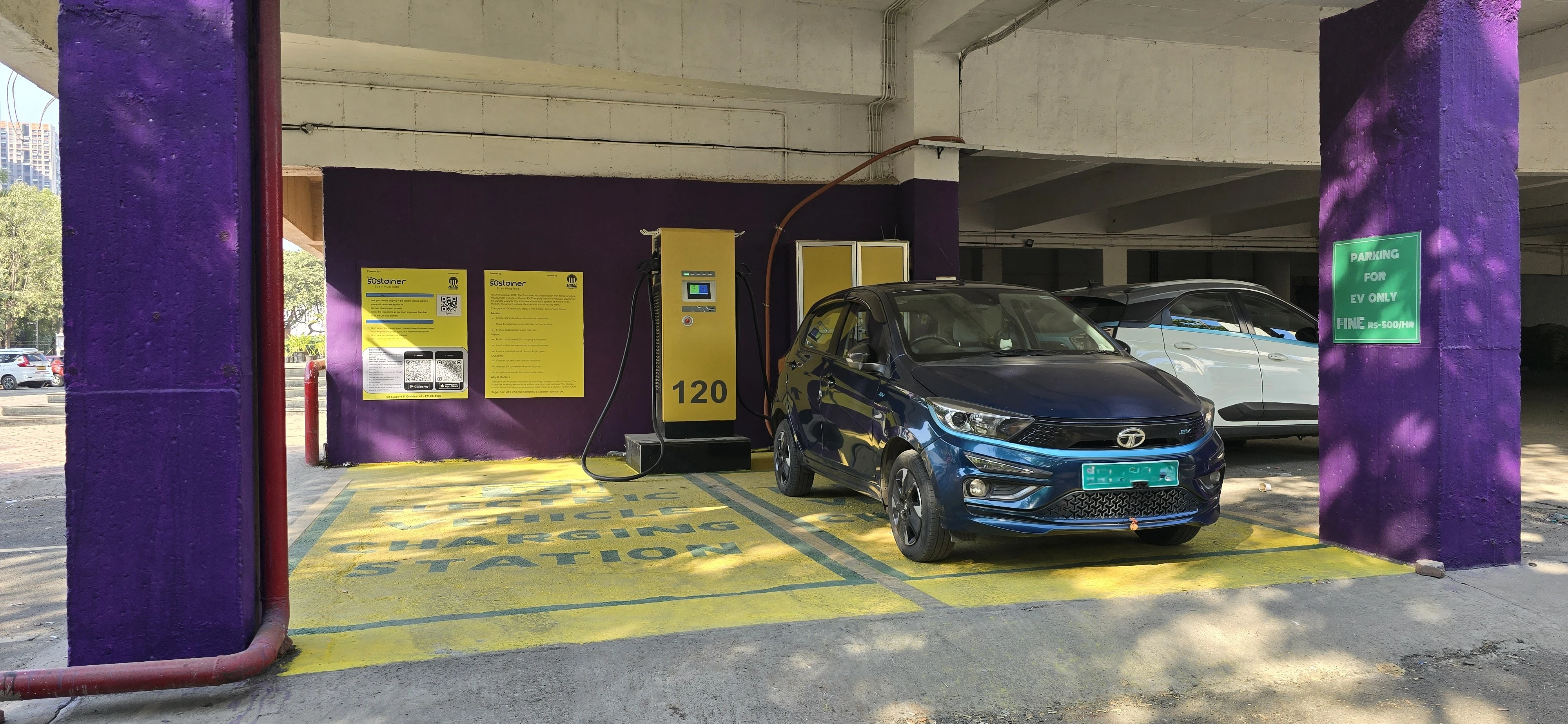 120 kW EV fast charging station installed in a covered parking area with an electric car charging